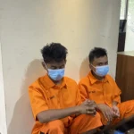 Garis polisi terpasang di lokasi penemuan jenazah wanita di kamar kos