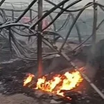 Petugas pemadam kebakaran menyemprotkan air ke puing gudang pipa paralon yang terbakar di Legok Tangerang